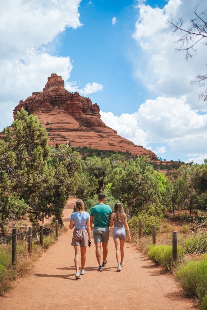 Father,And,Two,Kids,Hiking,At,Bell,Rock,Located,In